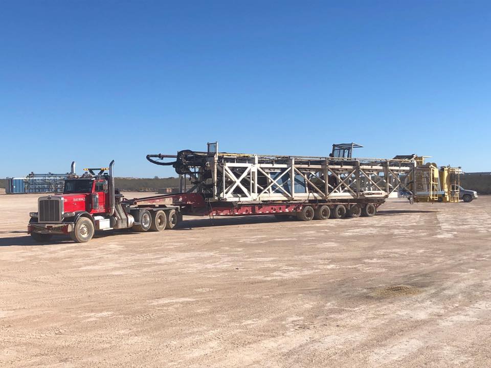 oil field truck moving heavy equipment